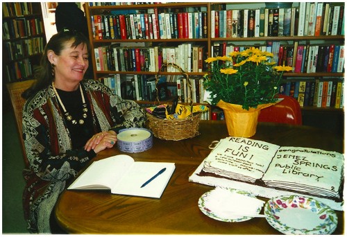 Alice Rodgers, Friends of the Library member, greeted visitors and later cut the cake. 