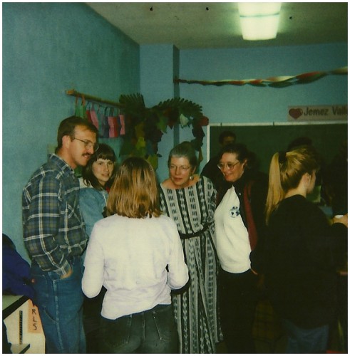 Judith Isaacs, Library Director, greets parents at an open house. 