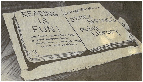 BOOK-SHAPED CAKE - Among the many delicious edibles at the library was this book-shaped cake, made by Dagna Althelde of the San Diego Canyon Bakery.
